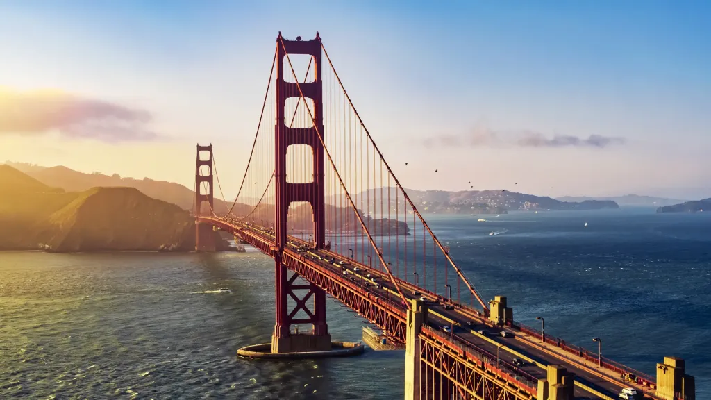 Golden Gate Bridge spanning the bay in San Francisco at sunset.